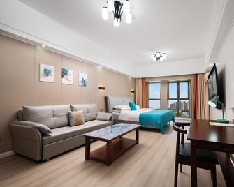 Yinuo Apartment Hotel (Wanda Plaza, Wuhan Sports Center Metro Station) - Wuhan - Living room