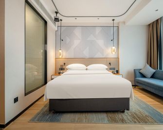 Borrman Hotel Beihai Hepu High-Speed Railway Station Haisi Shougang - 베이하이 - 침실