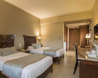 Sai Palace Hotel - מומבאי - חדר שינה