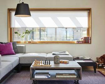 Gud Jard Chalet Nr 18 - Design-Ferienhaus mit exklusiver Ausstattung - Pellworm - Huiskamer