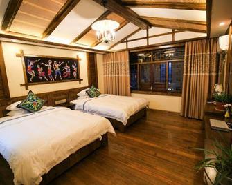 Zhangjiajie April Hostel - Zhangjiajie - Bedroom