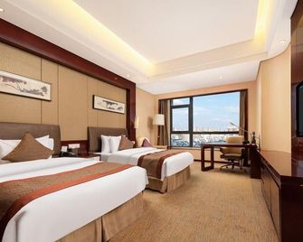 Howard Johnson by Wyndham Nanshan Plaza Bengbu - Bengbu - Bedroom
