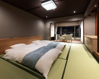 Higaki Hotel - Ґамаґорі - Спальня