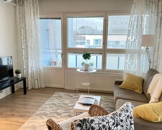 Kotimaailma KotikaksioKirkkok saunalla - Lahti - Olohuone