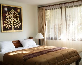 Tara Bed and Breakfast - קאנצ'אנאבורי - חדר שינה