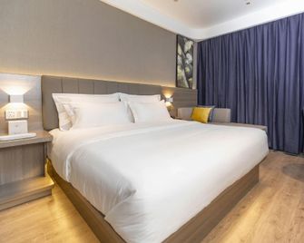 7 Days Premium (Zibo Zichuan Hongtai) - Zibo - Schlafzimmer