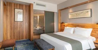 Yuanfei Hotel - Weifang - Bedroom