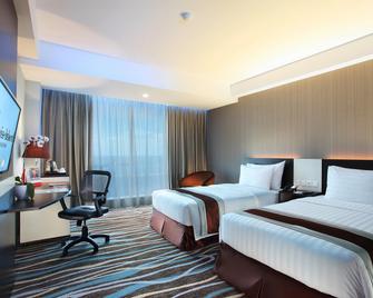 Swiss-Belhotel Makassar - Makassar - Schlafzimmer
