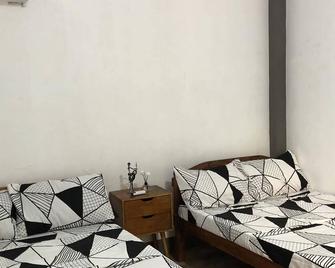 Clean Guesthouse in Patar Beach with Private open kubo on Public Beach Area - Bolinao - Bedroom