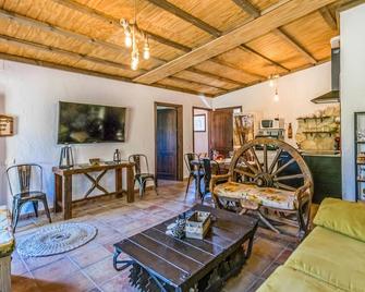 Fabulous vacation home with private pool and jacuzzi surrounded by gardens near the town of Rute, so - Rute - Living room