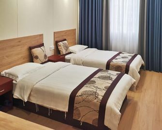 Dongsheng Business Hotel (Lantern Park Branch) - Zigong - Bedroom