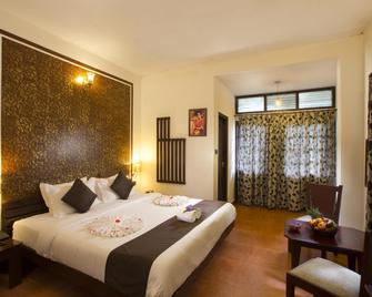 Madhumanthra Resort - Munnar - Bedroom