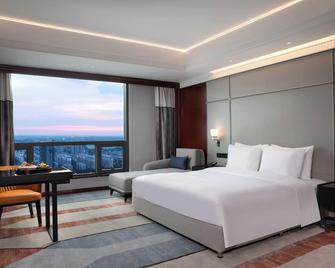 Yangzhou Wanda Yihua Hotel - Yangzhou - Schlafzimmer