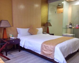 Golden Central Hotel Shenzhen - שנג'ן - חדר שינה
