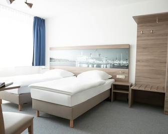 Komfortzimmer mit Gemeinschaftsbad - Gästehaus Rostock - Rostock - Chambre