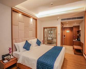 Regenta Place Bhopal by Royal Orchid Hotels Limited - Бхопал - Спальня