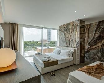 Hotel Luxor - מילאנו מריטימה - חדר שינה