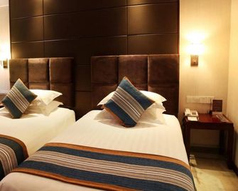 Jin Ying Hotel Guangzhou - Kanton - Slaapkamer