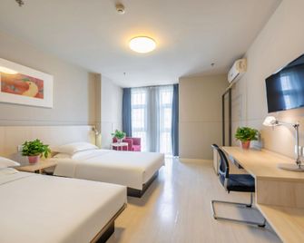 징장 인 호텔 톈진 중신 에코-시티 브랜치 - 톈진 - 침실