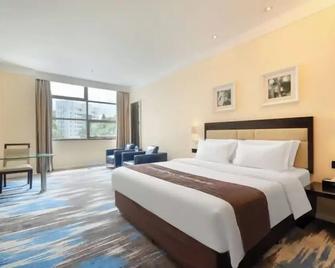 Kaiman Hotel - Zhuhai - Bedroom