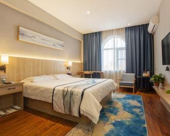 Jingman Qingshe Hotel (Shangqiu Wenhua Road) - Shangqiu - Bedroom