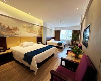 Weidong Garden Hotel - Ťing-čou - Ložnice