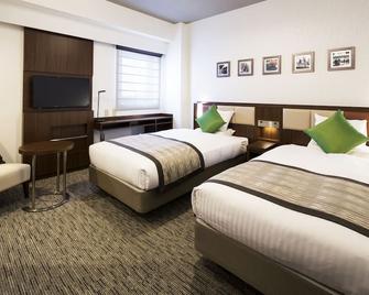 Hotel Mystays Shin Osaka Conference Center - אוסקה - חדר שינה