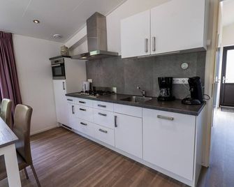 Carefree enjoyment in a luxury lodge with Sauna! - Wekerom - Cocina