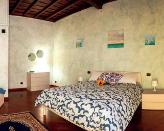 Un Posto al Centro - Manziana - Habitación