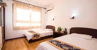Liuzhuang Huayuhai Holiday Hostel - Qinhuangdao - Bedroom