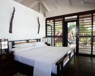Barrier Beach Resort - Saraotou - Bedroom