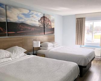Days Inn & Suites by Wyndham Siler City - Siler City - Bedroom