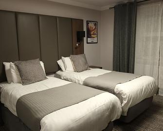 The Corn Mill Lodge Hotel - Leeds - Schlafzimmer
