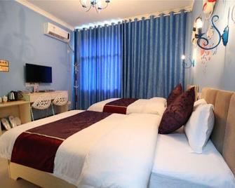 Yimi Yangguang Hostel - Zhangjiajie - Schlafzimmer