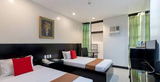 Check Inn Hotel Dumaguete City by RedDoorz - Dumaguete City - Bedroom