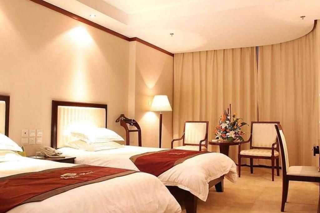 Yantai Jinghai Hotel - יאנטאי - חדר שינה