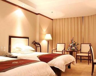 Yantai Jinghai Hotel - יאנטאי - חדר שינה