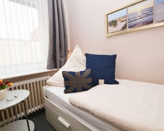 Hotel-Pension Anjo - בוסום - חדר שינה