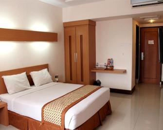 Ceria Hotel Jambi by Tritama Hospitality - Jambi - Bedroom