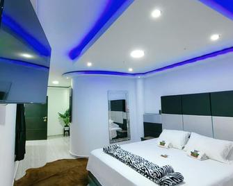 Hotel Parrilla Bar Safari's - La Unión - Habitación