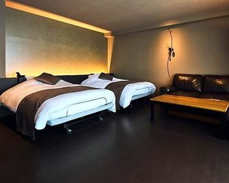 Oita Onsen Business Resort Kyuan - Ōita - Camera da letto