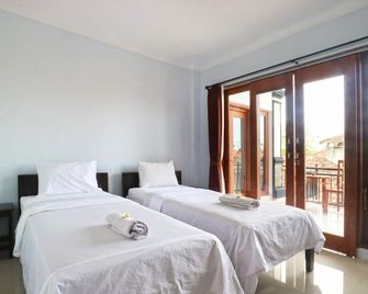 The Wina Echo Beach Guest House - North Kuta - Habitación