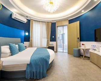 Yanling Bloom Hot Spring Hotel - Xuchang - Habitación