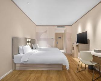 Hanting Express Harbin Railway Station Square - هاربين - غرفة نوم