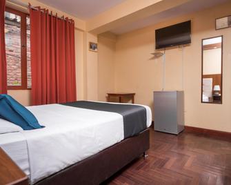 Ayenda Posada Inn - קוסקו - חדר שינה