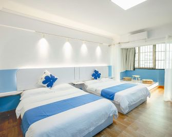 Nanning Gold Red Forest Hotel - נאנינג - חדר שינה