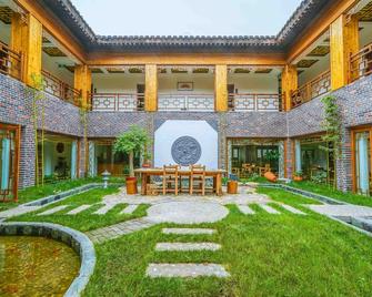 Yijie Holiday Hotel Taierzhuang Old Town - Zaozhuang - Binnenhof