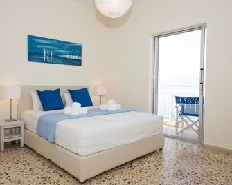 Spacious apartment on the beachfront - Melissi - Habitación