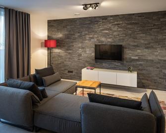 Home & Work Apartments - Pulheim - Вітальня