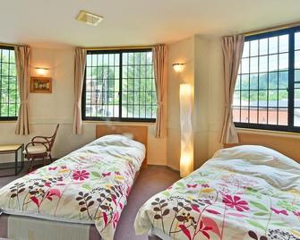 Petit Hotel Iris - Otari - Спальня
